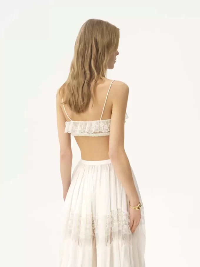 Biustonosz typu bralette z cienkimi ramiączkami i falbanką, wykonany z haftowanej koronki Biustonosz typu bralette z cienkimi ramiączkami i falbanką, wykonany z haftowanej koronki