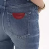 Jeansy z wysokim stanem i rozszerzanymi nogawkami typu bootcut z denimu