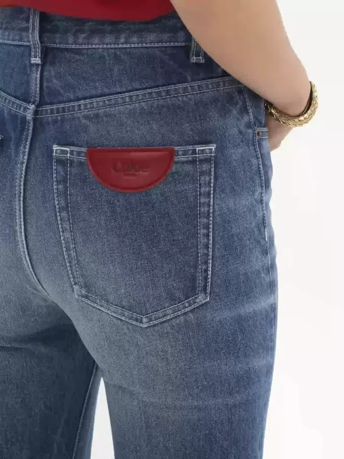 Jeansy z wysokim stanem i rozszerzanymi nogawkami typu bootcut z denimu