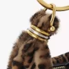 Mini torebka typu hobo z bransoletką z owczej skóry w panterkę Mini torebka typu hobo z bransoletką z owczej skóry w panterkę