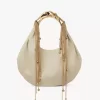 Torba typu hobo Twisted Shell z błyszczącej skóry Torba typu hobo Twisted Shell z błyszczącej skóry